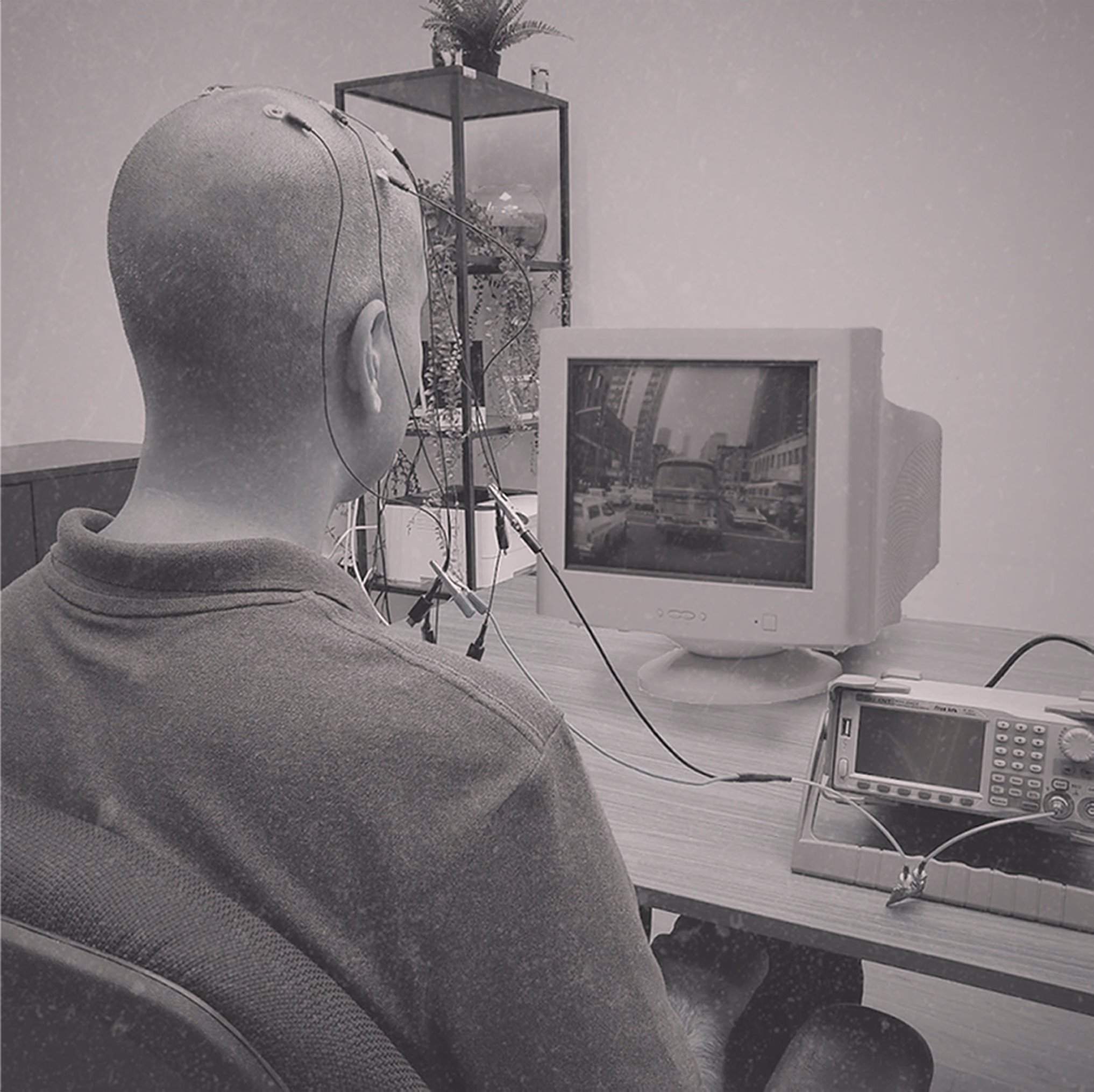 Traditional EEG setup with multiple electrodes and clinical equipment.