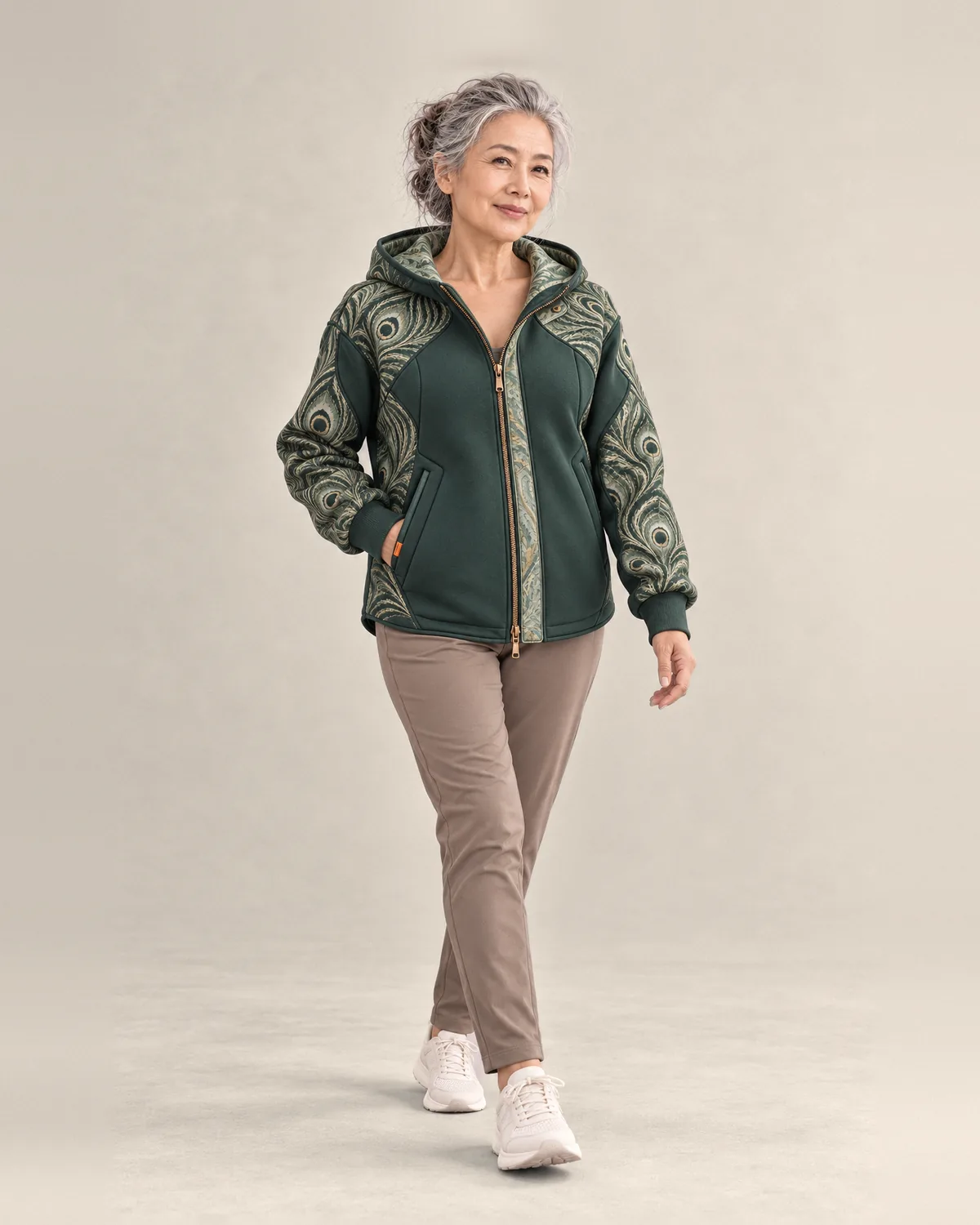 Woman wearing the Quest Hood in Pine
