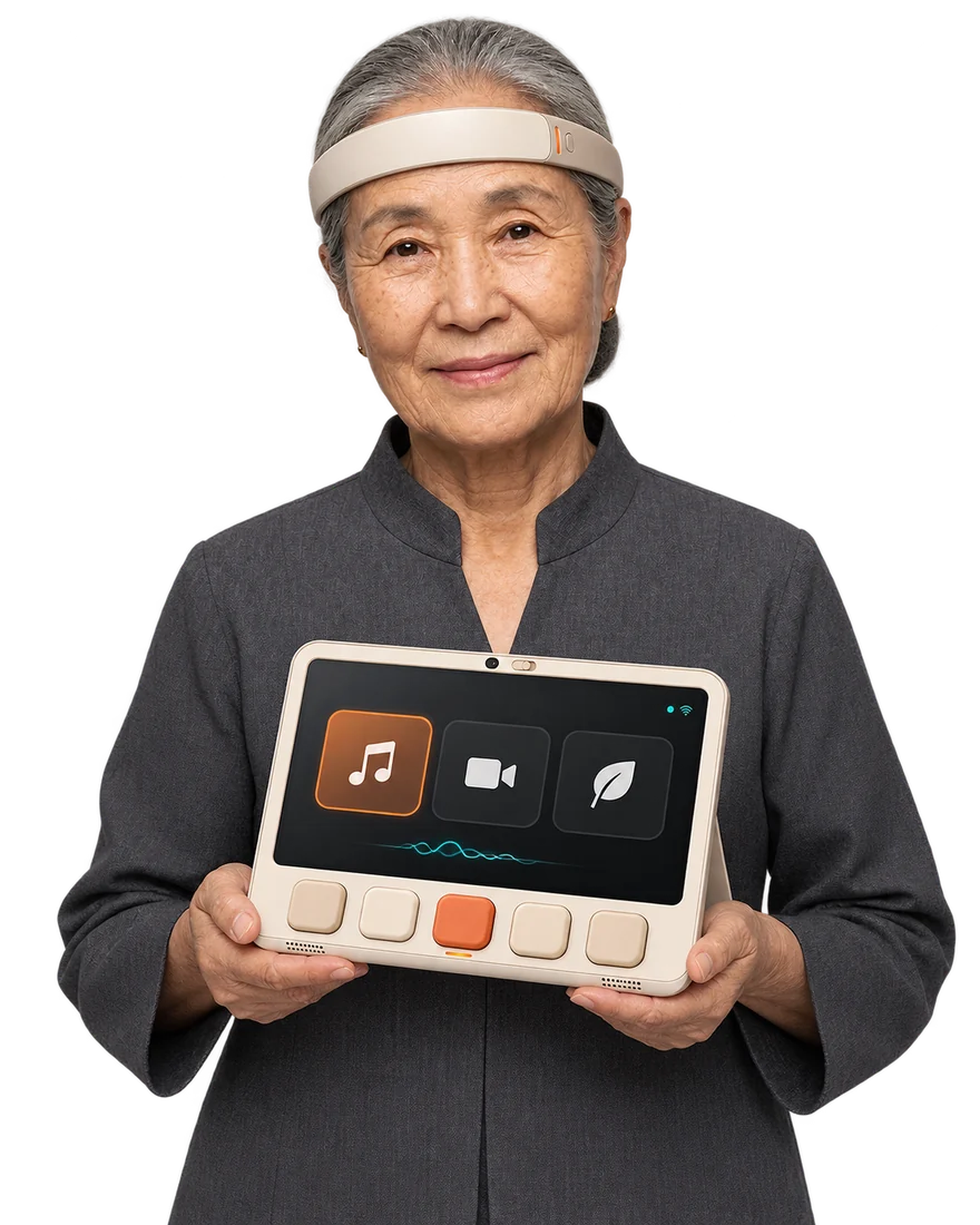 An older Korean woman wearing Brainwear, smiling as she holds her qPad